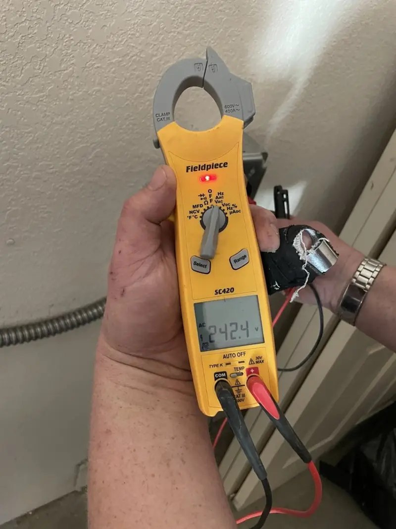 Voltage testing with clamp meter during Recessed Lighting Installation in Charlestown
